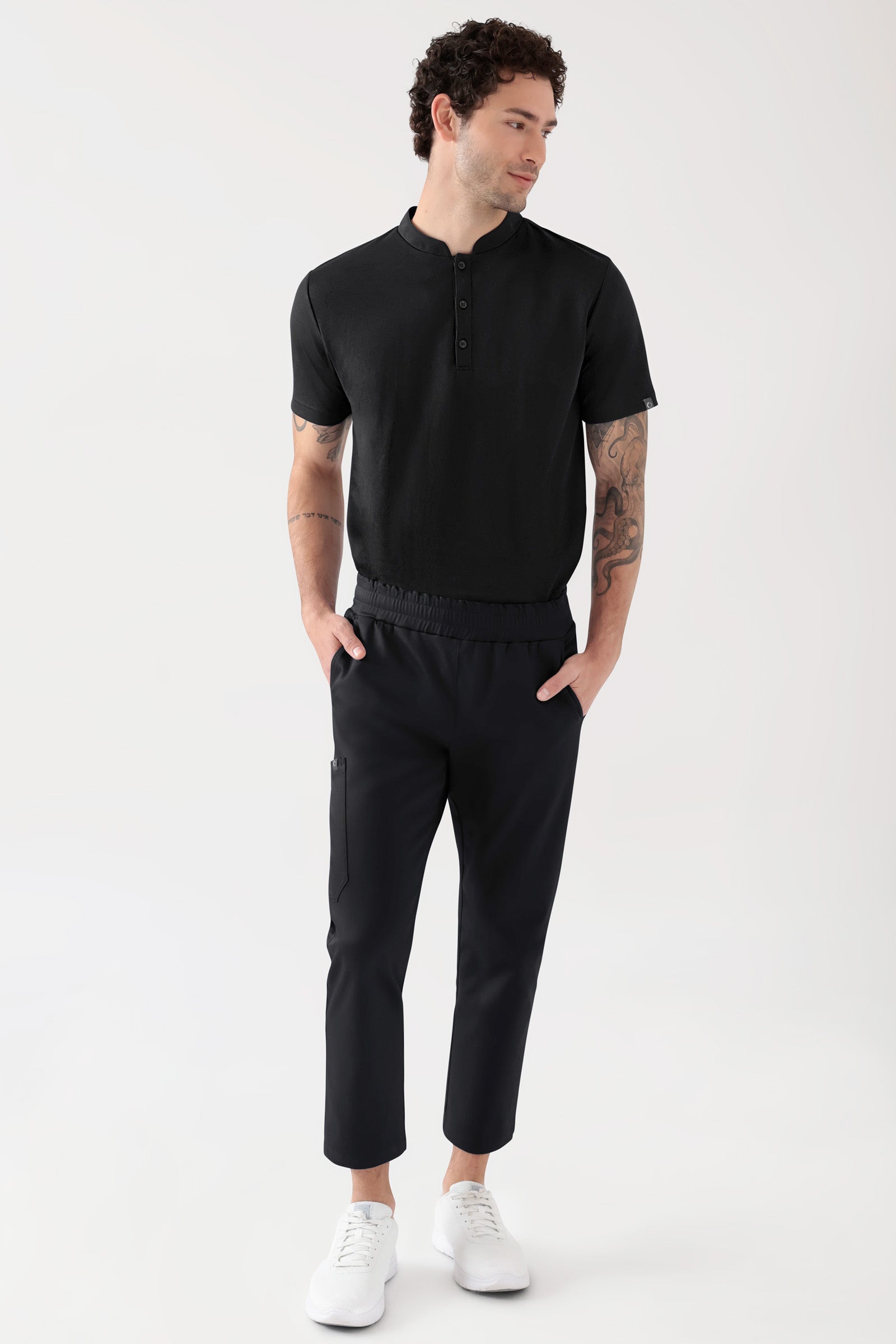 COMFY FLEX Stretch broek Unisex - 7/8 Lengte zwart, Voorzijde view Het model is 188 cm lang en draagt maat M